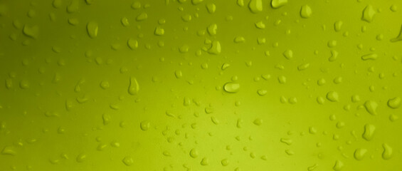 Abstract water drops on the yellow green wall. Suitable for promotion and advertising, website, tech industry and company, etc.	