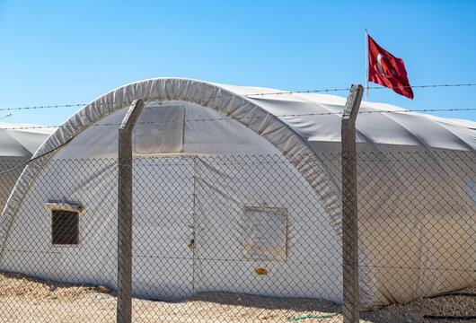 The living tent, which can protect from cold and hot climatic conditions, is in selective focus. The tent is behind the fence. Turkish Flag in the background.