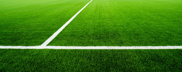 Obraz premium Green football field of artificial grass. White line on the soccer field.