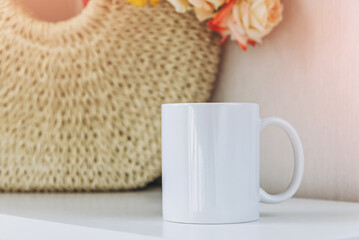 White cup of coffee on table, mockup.