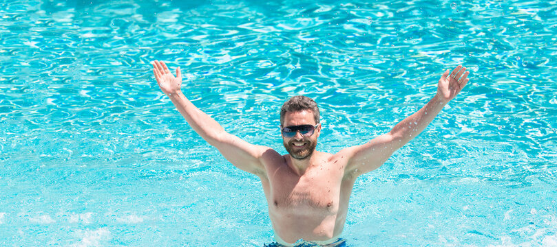 happy handsome guy in sunglasses swimming in pool on summer, pool party. Man face portrait, banner with copy space.