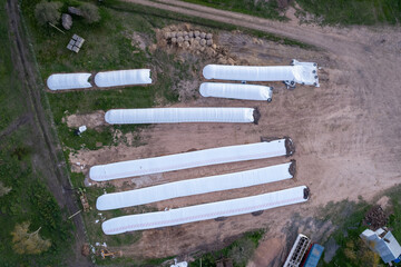 aerial view of silo bag in a field. Rural, country image of the agricultural industry in a field in Argentina. © fernando