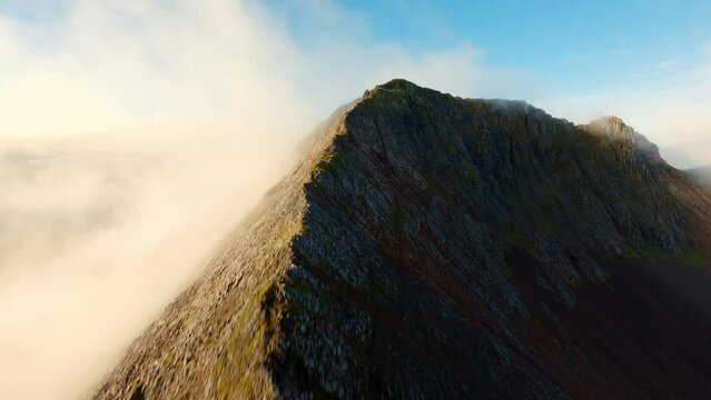 FPV Aerial view of Mount Snowdon along the Crib Goch hiking route, Snowdonia, Gwynedd, North Wales, United Kingdom