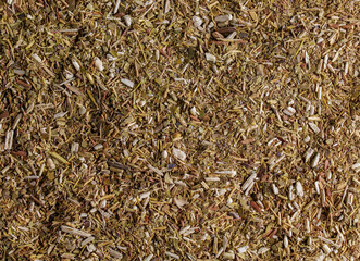 Dry yerba mate leaves, traditional drink of Argentina. Background and texture of dry tea.