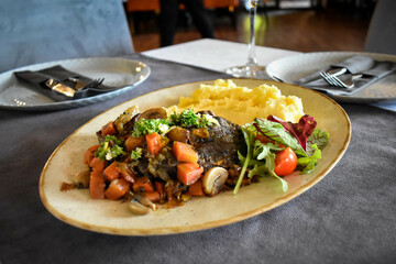 Ossobuco or osso buco.  Classic braised veal from northern Italy.