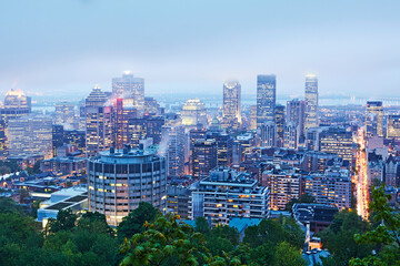 Aerial view of the skyline of Montreal, Canada illuminated at dusk