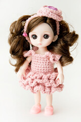 Baby girl cute doll with colorful hand crocheted knitting dress.