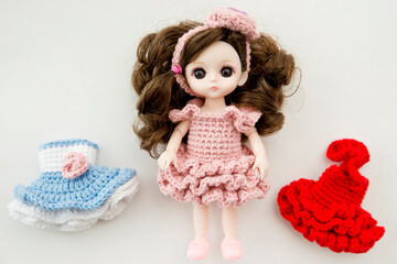 Baby girl cute doll with colorful hand crocheted knitting dress.