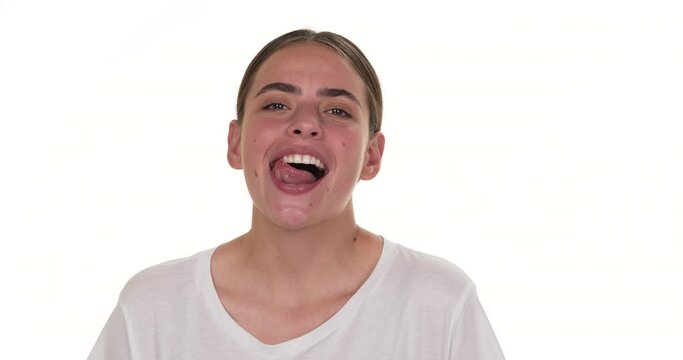 Portrait of white woman sensually smiling and licking her teeth. Isolated on white background.