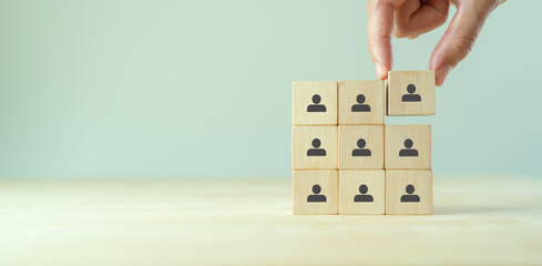 Employee recruitment and team building concept. Work collaboration for achieving goal and successful business. Productive people skills. Wooden cubes with recruiting, team building icons. HRM Banner.