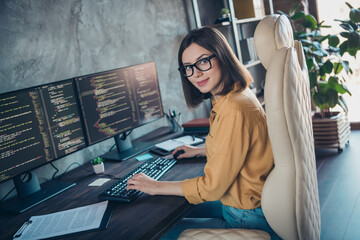 Profile side view portrait of attractive cheery girl expert developing operating system html css at...
