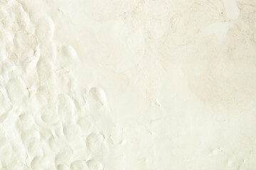 White plasticine texture with finger prints. Modeling clay material pattern background.