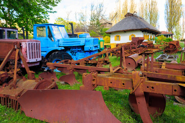 Old equipment for cultivating agricultural fields in Open air Museum of Folk Architecture and Folkways of Middle Naddnipryanschina in Pereyaslav, Ukraine - obrazy, fototapety, plakaty