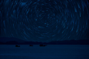 Fototapeta premium Boat crashes in the sea and star trails Climate change.
