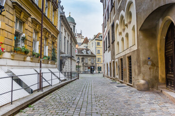 Fototapeta na wymiar Cobblestoned street in the old part of Vienna, Austria