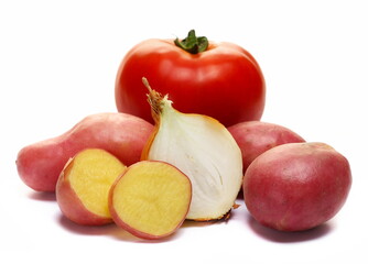 Fresh organic young potatoes slices, red tomato with half onion isolated on white  