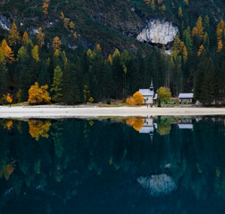 Cappella "Lago di Braies" - beautiful сhapel by the Braies lake. Lago di Braies (Pragser Wildsee) is a wild lake in the Dolomites in South Tyrol, Italy.