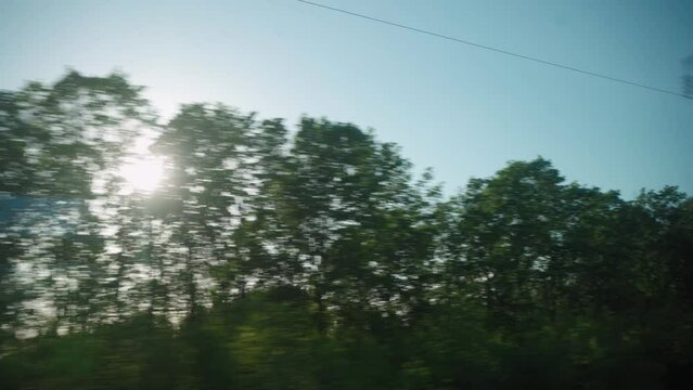 Bullet train rides on the railway track. Journey and trip on train. Interior view at train's empty window.
