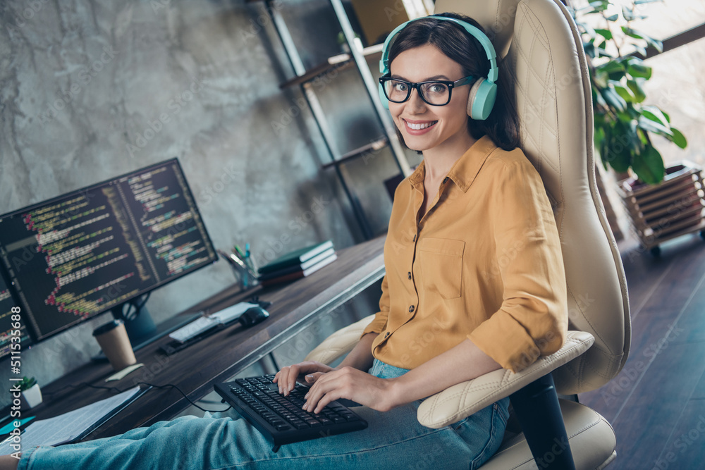 Poster portrait of positive attractive hacker lady sitting chair keyboard write edit operating database off