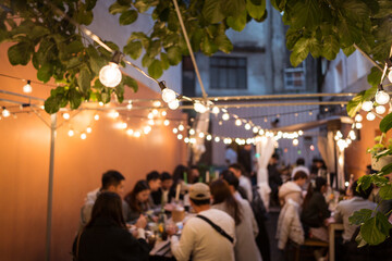 People celebrating wedding in street at night