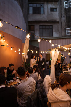 People Celebrating Wedding In Street At Night