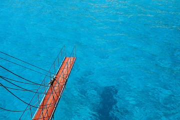 ship's gangway for jumping into turquoise water