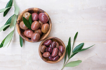 Wooden bowls of delicious olives