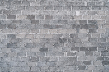 Gray brick wall. Abstract gray rough background. Brickwork.