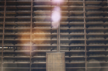 Shelving with cobblestones. Warehouse at the factory. Production of paving slabs. Sun glare.