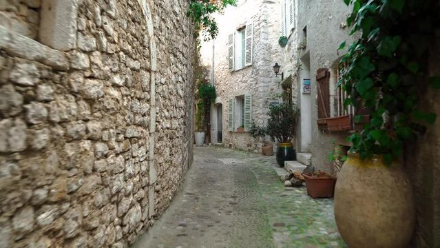 Medieval fortified village of Saint-Paul-de-Vence.
Empty narrow street in the south of France. Window openings and doors are decorated with decorative trim in St. Paul de Vence. Colorful old street