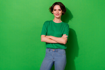 Photo of funny confident lady wear spring outfit arms crossed smiling isolated green color background - obrazy, fototapety, plakaty