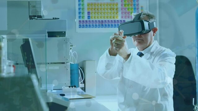 Animation of scientific data over caucasian senior male lab worker using vr headset