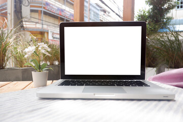Cropped shot view of office desk table office equipment, labtop, tablet and other office supplies on the modern space, flat lay.
