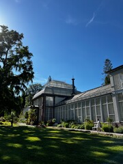 Beautiful old greenhouse in an English garden at the afternoon, perfect tea time 