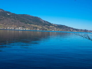 Amazing aerial view of Lake Hallstatt in Austria. The Hallstätter Lake is one of the most famous lakes in the upper austrian Salzkammergut. Dachstein mountains in the background. Hallstatt, Austria