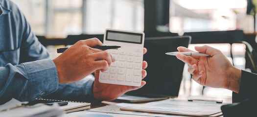 The financiers are calculating personal taxes for their customers.