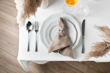 linen white tablecloth and beige napkin