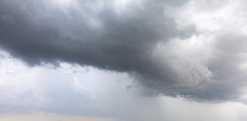 Dark dramatic sky with a stormy gray clouds just before storm . The rain is coming soon. Pattern of...