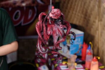 hanging grilled otopus culinary