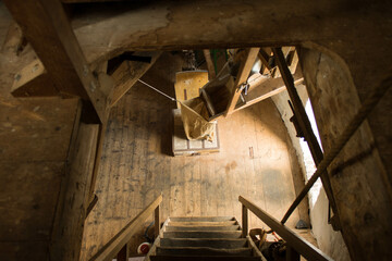 Fototapeta premium View from the attic of a flour mill, one level lower, where the flour, at the end of the grinding process, is collected in a flour bag. This scaffolding mill was built in 1960 in Oss (Netherlands).