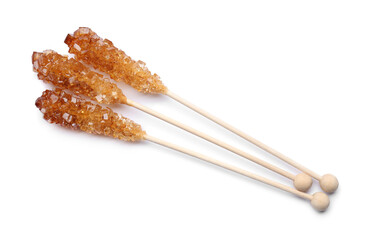Wooden sticks with sugar crystals isolated on white, top view. Tasty rock candies