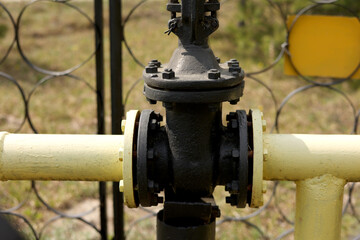 Yellow gas pipes and valves outdoors. gas equipment. Copy space for text. High quality photo