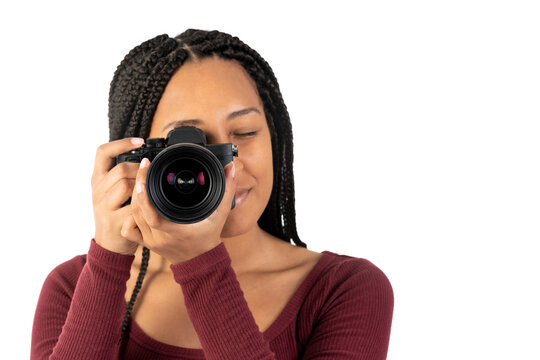 Young black woman with a photo camera in the studio