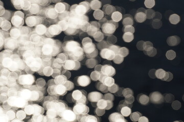 Sun reflecting in water - defocused background, bokeh effect