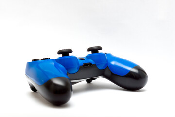 Blue gaming controller isolated on white background. Videogame console gamepad. 