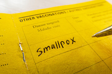 record of vaccination against smallpox on the yellow vaccination book.