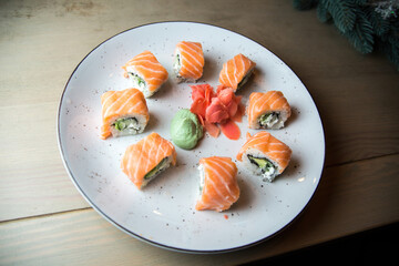 Japanese food restaurant, salmon sushi maki gunkan roll plate or platter set. Set for two with chopsticks, ginger, soy, wasabi. 