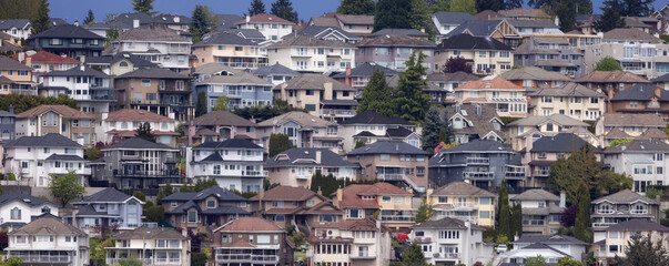 Fototapeta premium Residential homes on a mountain in suburban neighborhood. Modern Cityscape. Port Coquitlam, Vancouver, BC, Canada.