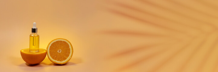 Banner front view of amber colored essential oil bottle.