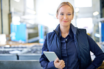 Ive got this warehouse running smoothly. Portrait of an attractive young female worker in a...